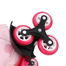 Backpack roller wheel set with pink rims and black frame, side handle visible
