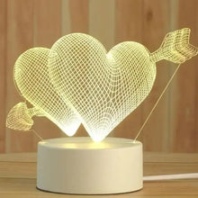 Glowing heart arrow LED night lamp with wire heart cutouts on a white base