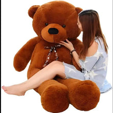 Large brown teddy bear plush with black nose and bow ribbon, seated pose