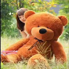 Large brown teddy bear plush with front-facing face and black bow ribbon