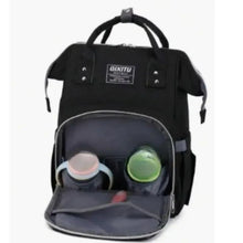 Black diaper backpack with open top showing baby bottles in front compartments