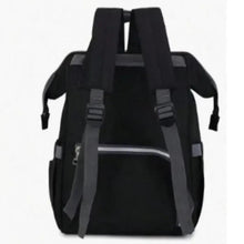 Black diaper backpack with padded back straps and vertical storage panel