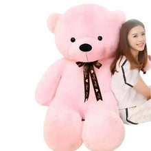 Pink plush teddy bear with black nose and dark bow tie ribbon