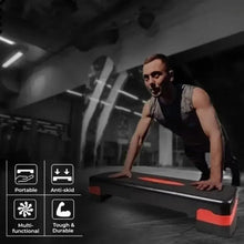Portable aerobic step platform with textured surface and red side rails, black base