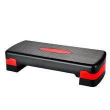 Portable aerobic step platform with textured non-slip top, black base with red accents