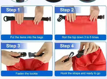 Red PVC dry bag with roll-top closure and black buckle straps