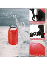 Red PVC dry bag with roll-top buckle and reinforced seams, waterproof construction