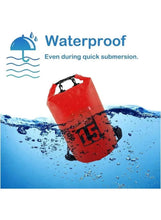 Red PVC waterproof dry bag, roll-top with black handle straps in water