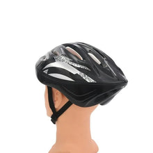 Skating helmet in black with white geometric graphics, worn on a head