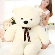 White teddy bear plush with brown ribbon bow and black button eyes