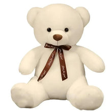 White teddy bear plush with brown ribbon bow and round black eyes