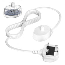 Electric toothbrush charger base with white cable, plug, and clear protective cap