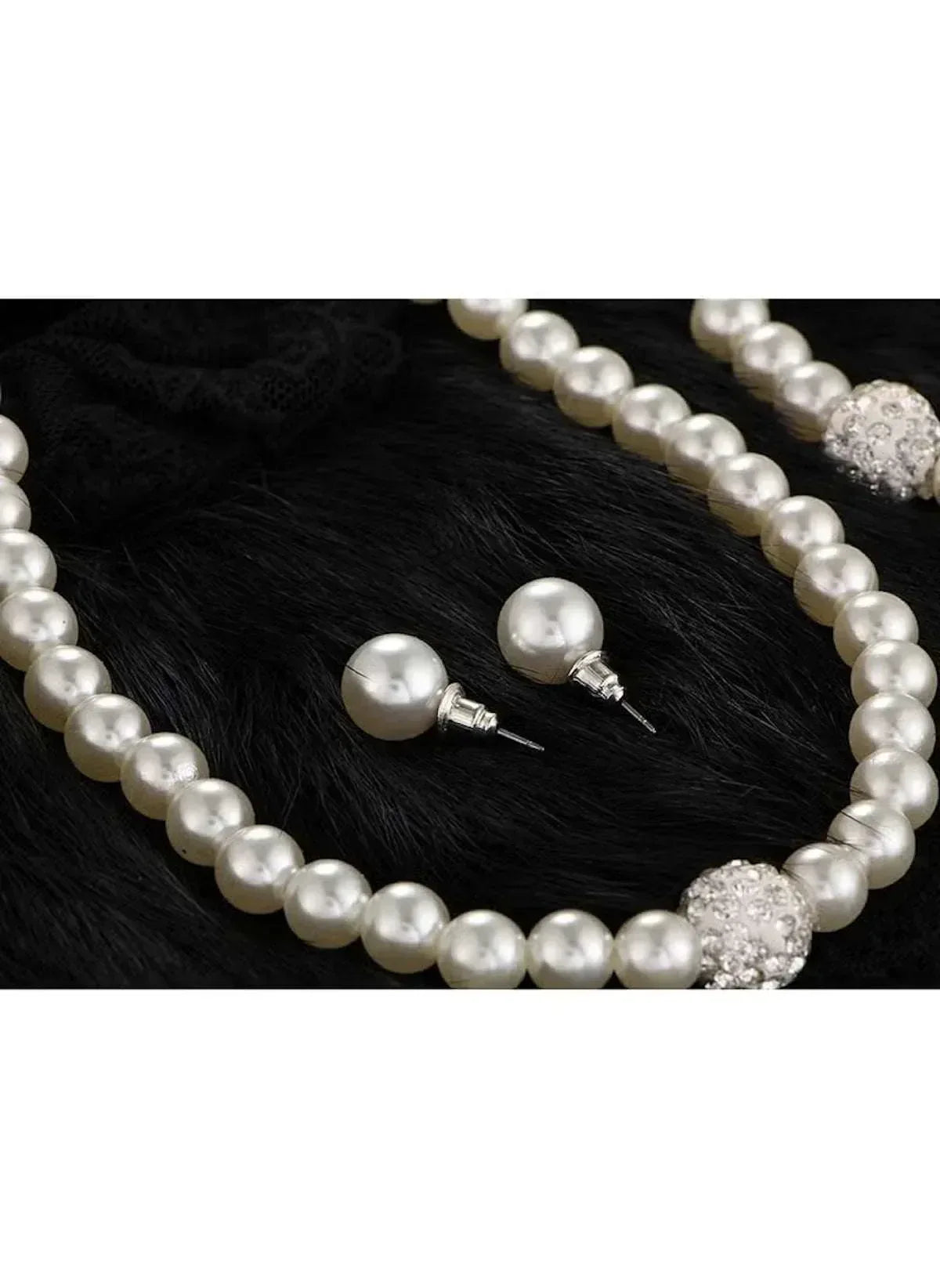 Faux pearl necklace with matching stud earrings and bracelet