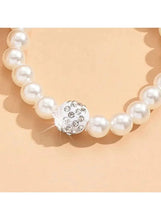 Faux pearl necklace with round crystal-look bead and clustered stones