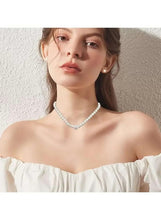 Faux pearl necklace with small matching earrings on model