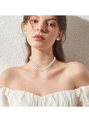 Faux pearl necklace with small matching earrings on model