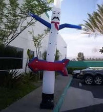 Inflatable chef tube with tall white head, black moustache, red scarf, blue waving arms