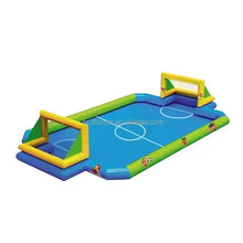 Inflatable football pitch with blue playing surface, green borders, and yellow goals