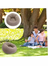 Inflatable lounge chair in light taupe, bean-shaped seat for lounging outdoors