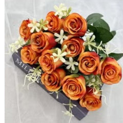 Huitich artificial flowers featuring orange roses with green leaves displayed on box with inflatable lounge chair with backrest