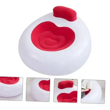 Inflatable lounge chair with red backrest and heart-shaped seat insert on white