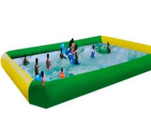 Inflatable outdoor swimming pool with yellow sidewalls and green base, kids playing