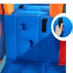 Close-up of blue inflatable water slide for kids showing sturdy handle and circular holes for safety
