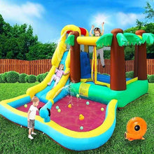 Kids inflatable water slide with palm tree posts and red splash pad, blue slide track