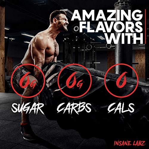 Muscular man flipping heavy tire in gym for Insane Labz psychotic pre workout powder UAE showing zero sugar carbs cals