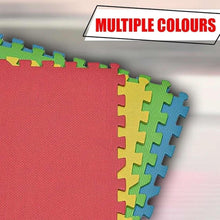 Interlocking foam floor mat tiles with red, green, and blue surfaces and jigsaw edges
