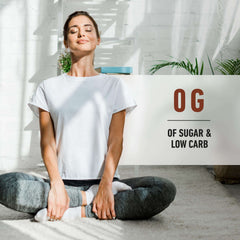 Woman meditating cross legged in bright sunlit room next to Isopure whey protein isolate banner noting 0g sugar low carb