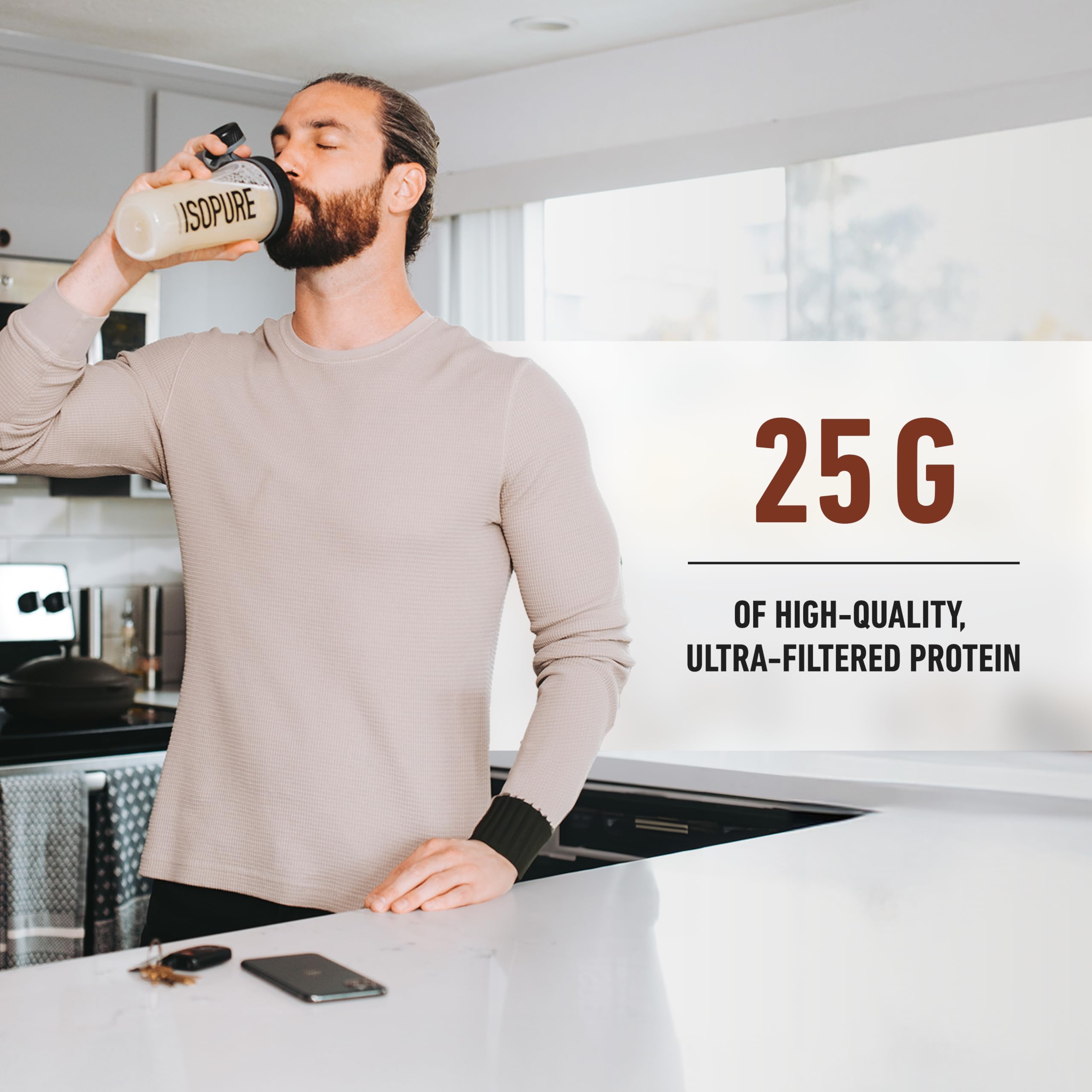 Man drinking from Isopure shaker in kitchen with Isopure whey protein isolate label visible