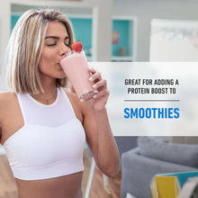 Woman sipping a protein shake from a glass with strawberry garnish