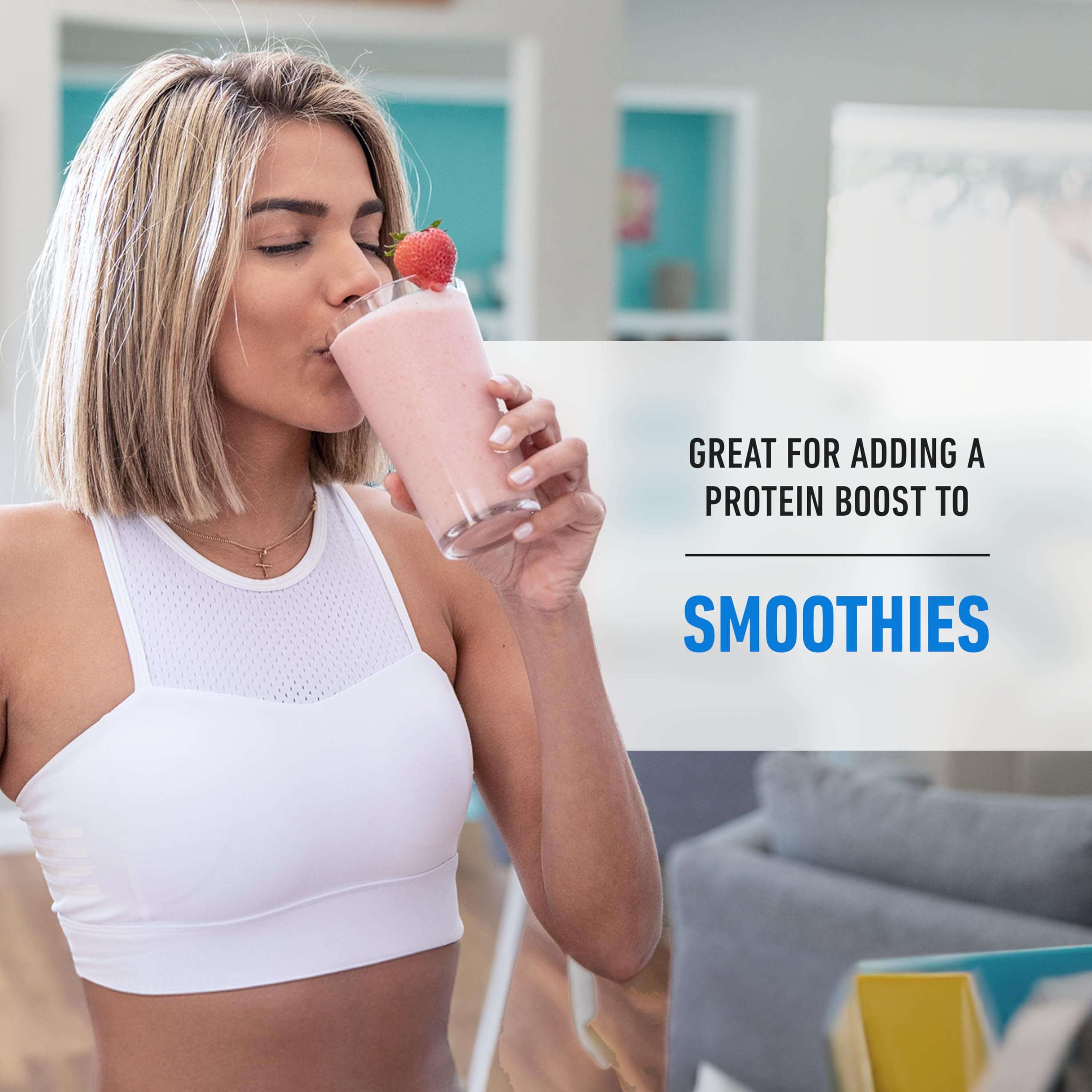 Woman in white workout top drinking strawberry smoothie with Isopure Zero Carb Whey Protein