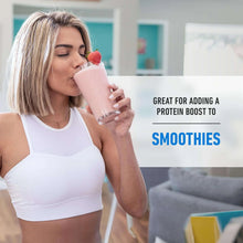 Woman drinking a creamy protein shake from a glass with strawberry garnish