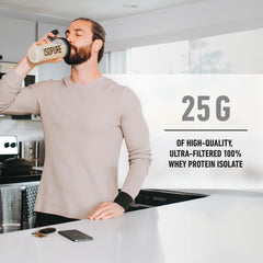 Isopure supplement bottle in kitchen being sipped by man with text showing 25g of zero carb whey protein isolate