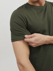 Close-up of a man wearing a green crew neck t-shirt men from Jack & Jones