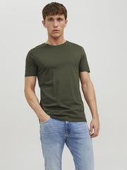 Green crew neck t-shirt men worn by casual model paired with light blue jeans from Jack & Jones Store
