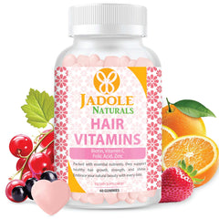 Jadole Naturals bottle of hair growth vitamins gummies with pink heart shaped gummies and oranges and berries