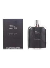 Black eau de toilette spray bottle with silver cap and matching box