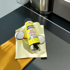 Mumzar yellow engine degreaser diversion safe can on microfiber cloth with small metal tools on workbench