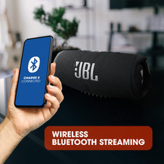 JBL Charge 5 portable Bluetooth speaker in black with a smartphone showing Bluetooth connection for wireless streaming
