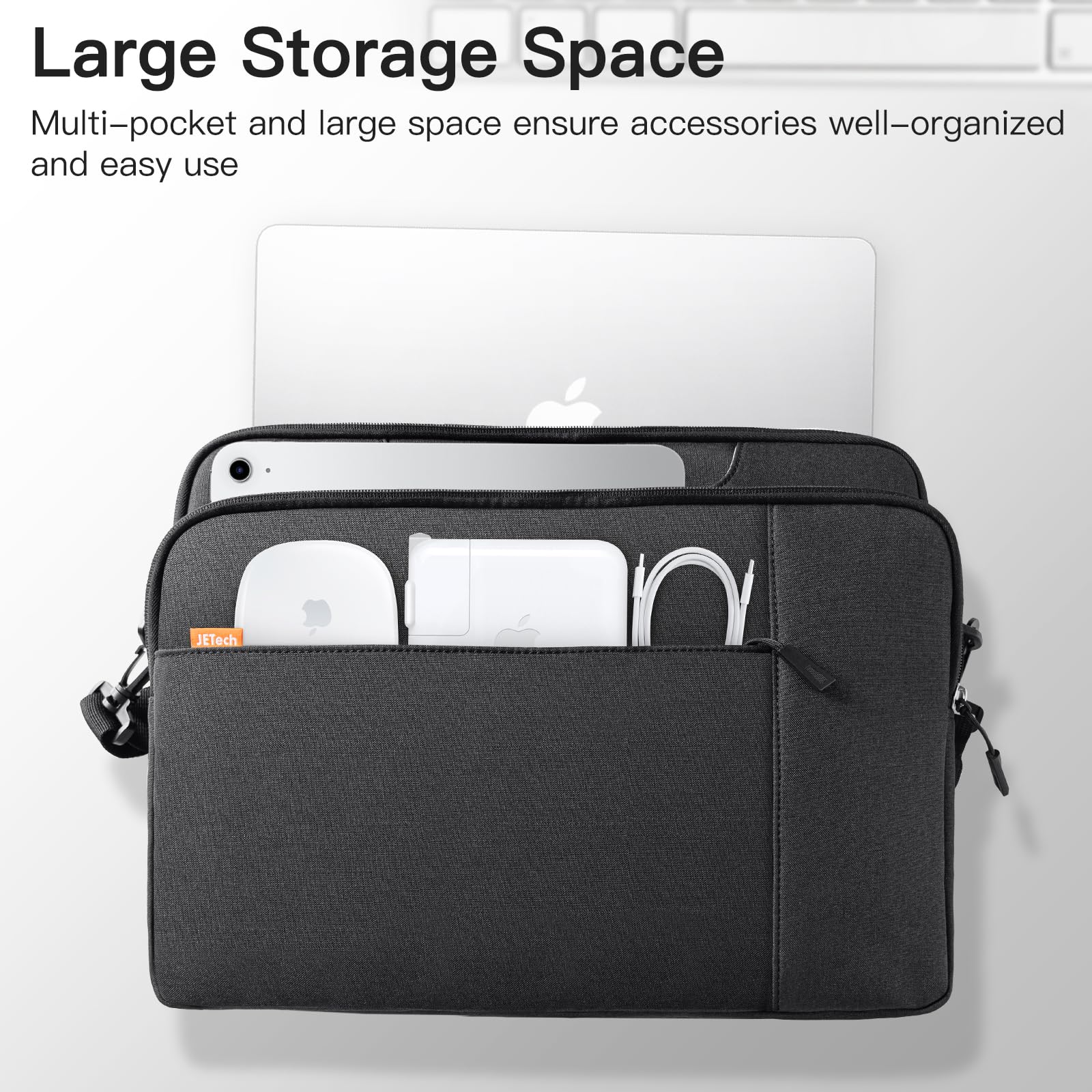 JETech laptop case with shoulder strap in black showing large storage space with laptop and accessories