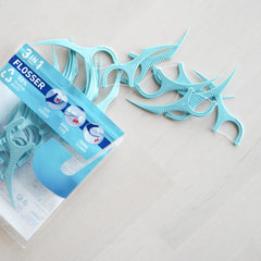 Jordan 3in1 dental flossers light blue plastic pack spilling multiple floss picks with pick tips and curved handles