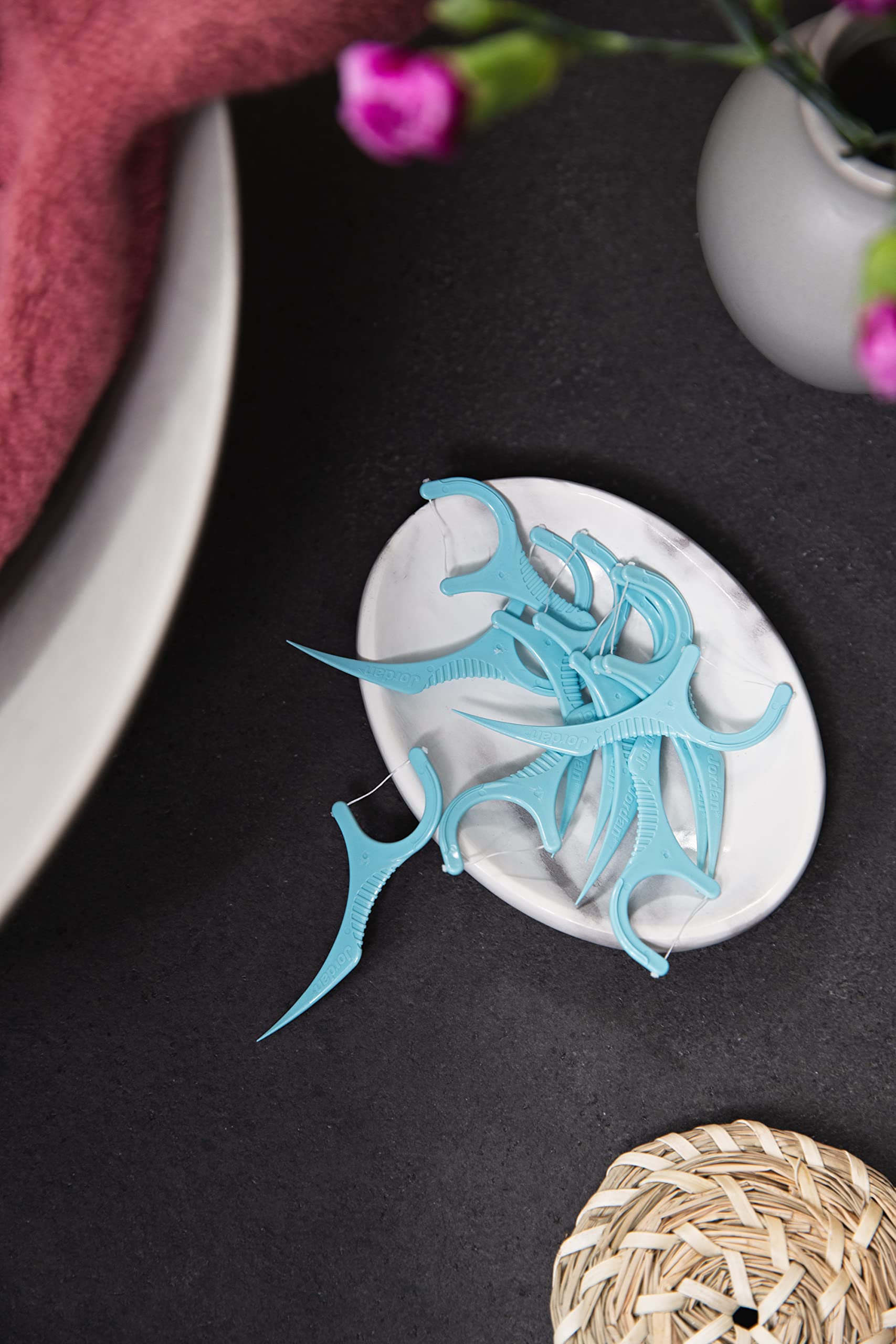Jordan 3in1 dental flossers light blue plastic floss picks in small dish on bathroom counter for travel
