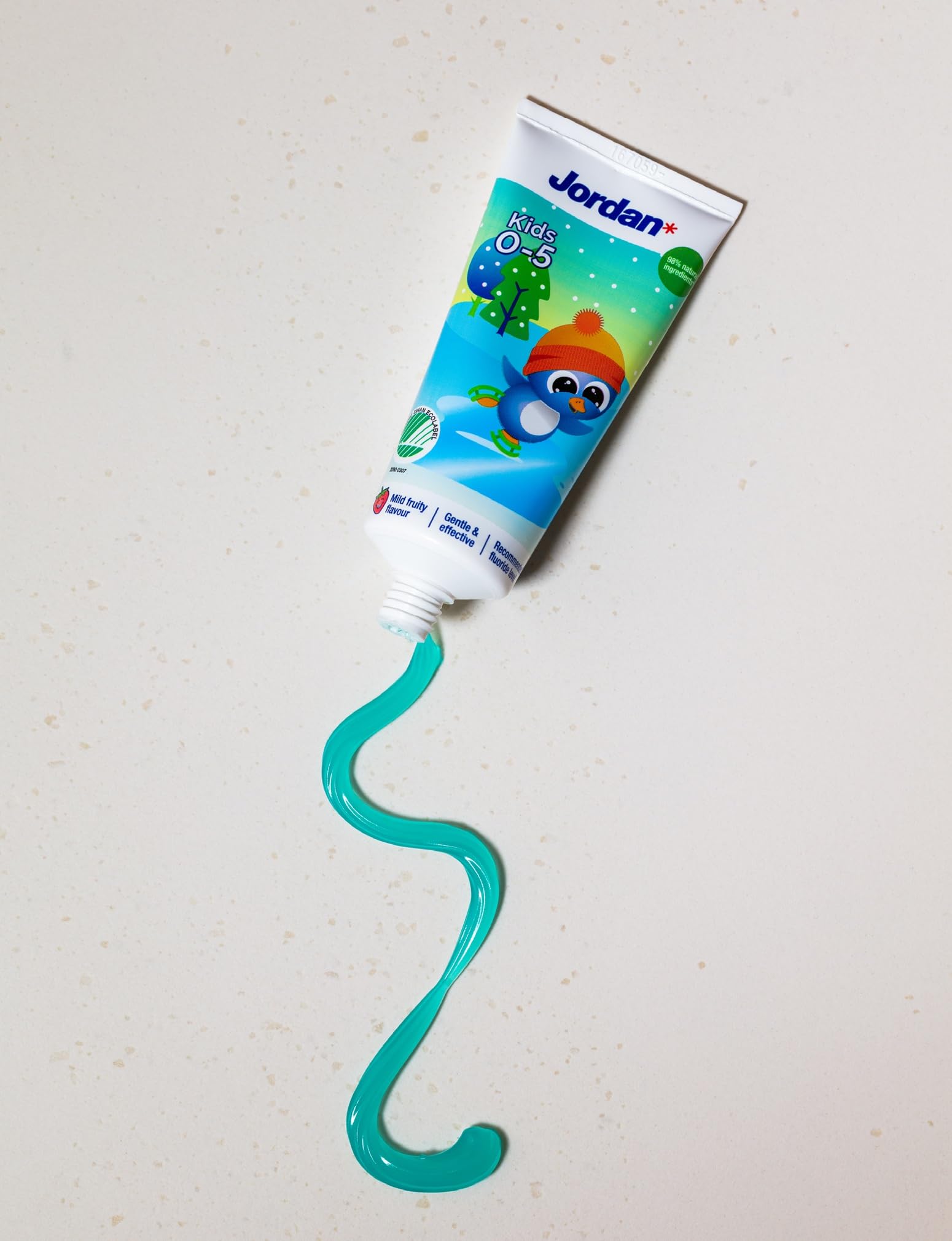 Jordan tube of kids toothpaste for 0-5 years with penguin packaging and teal paste squiggle on white background