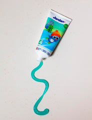 Jordan tube of kids toothpaste for 0-5 years with penguin packaging and teal paste squiggle on white background