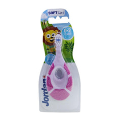Jordan pink infant toothbrush with ergonomic handle and soft bristle toothbrush for infants 0 to 2 years