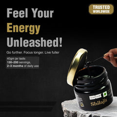 Kapiva jar of Shilajit with spoon and label on stone next to Feel Your Energy Unleashed text Himalayan Shilajit resin 40g UAE