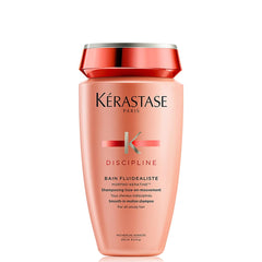 Kérastase curly hair smoothing shampoo in a pink bottle designed for frizz control and smoothness